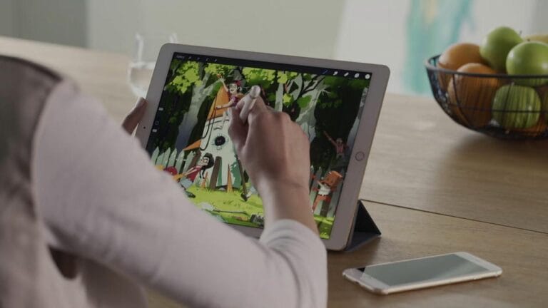 A Person making design on an I Pad as a graphic designer